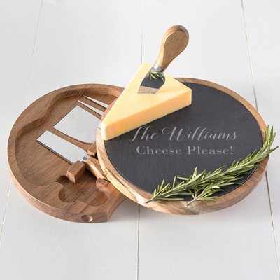 This acacia wood and slate cheese set is a unique gift for a couples shower. The slate top swivels to reveal four stored utensils. Personalize for that special touch.