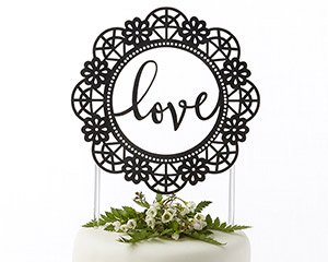 "Love" is in the center of this lacey cake topper design.