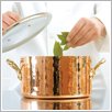 Cooking pot with glass lid for gourmet cooking.