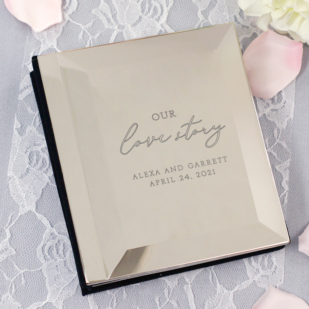 This engraved silver photo album, holding  100, 4" x 6" photos, is the perfect bridal shower gift.